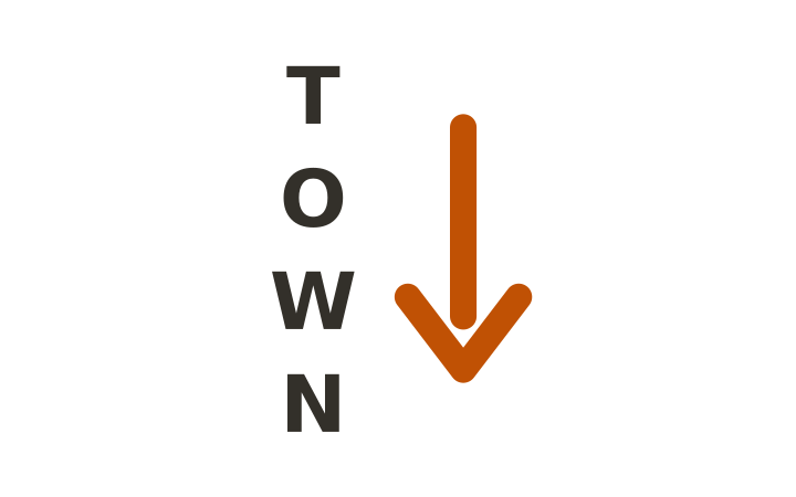 Rebus puzzle: the word TOWN written vertically beside a large downward arrow